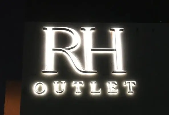 Illuminated projecting sign for downtown retail storefront