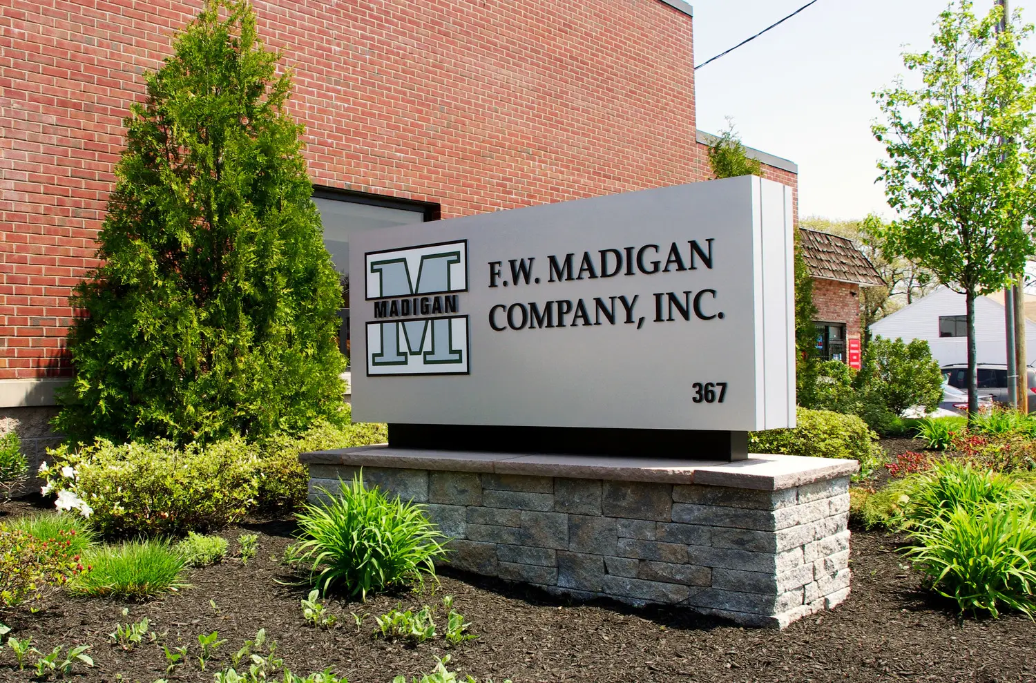 Dimensional corporate monument sign with raised lettering