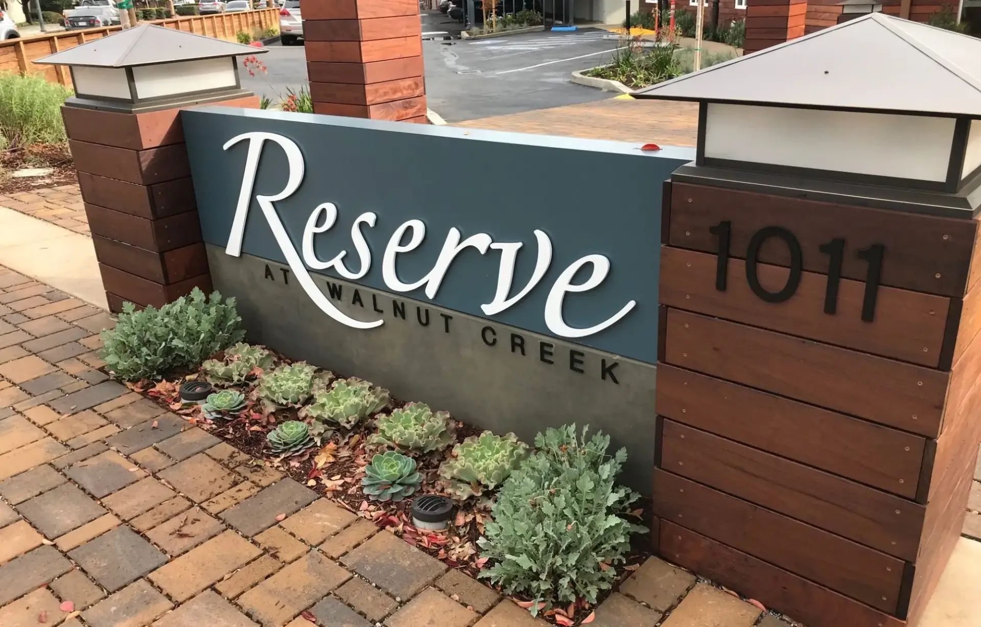 Natural stone and brushed metal monument sign